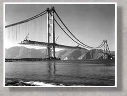 Golden Gate bridge roadway being assembled in sections and attached to suspender ropes (from: www.goldengatebridge.org